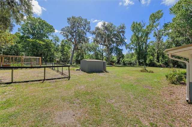 view of yard with a storage shed and an outdoor structure