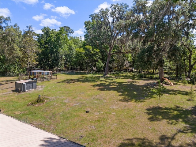 view of yard featuring exterior structure and an outbuilding