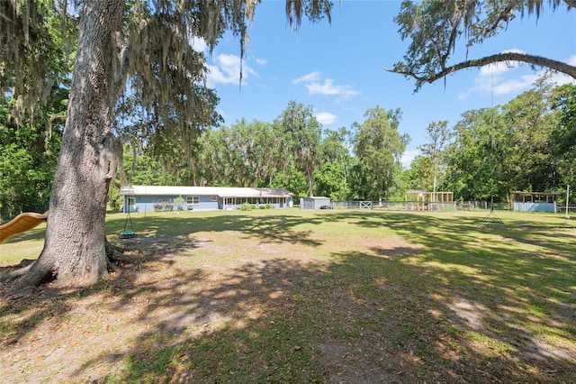 view of yard featuring fence