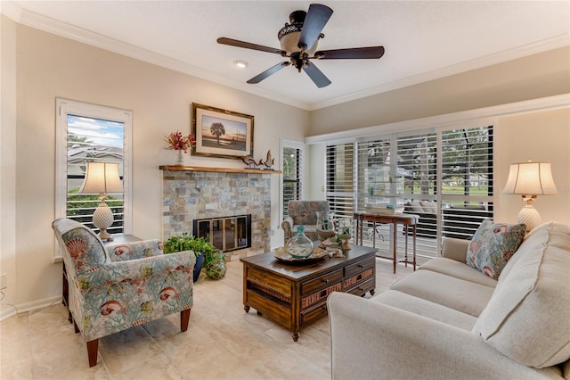 living room featuring a stone fireplace, ornamental molding, and a wealth of natural light