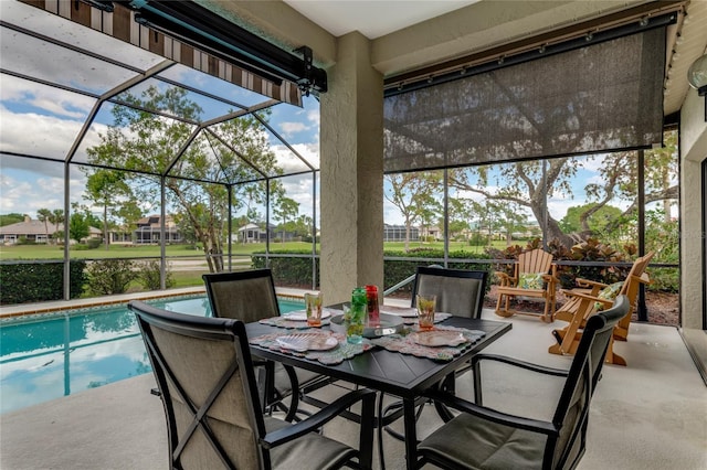 view of patio / terrace featuring a lanai and an outdoor pool