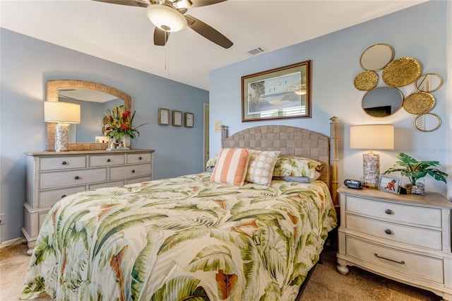 bedroom featuring light carpet, a ceiling fan, and visible vents