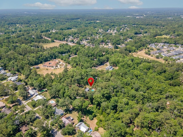 aerial view featuring a wooded view
