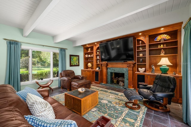 living area featuring a fireplace, built in shelves, beam ceiling, wooden ceiling, and stone tile flooring