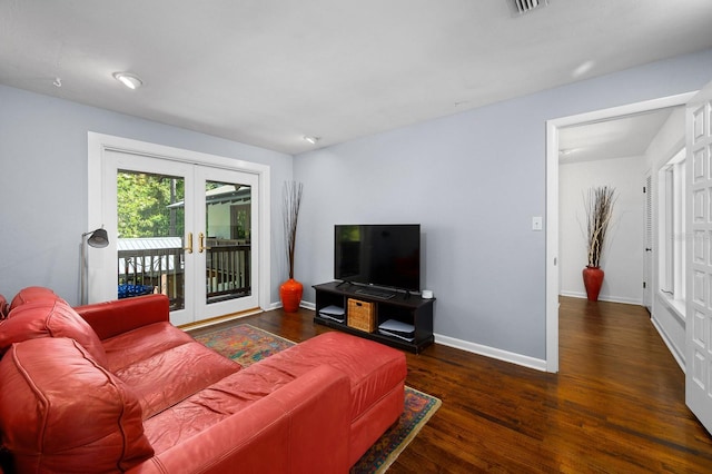living area featuring french doors, baseboards, and wood finished floors