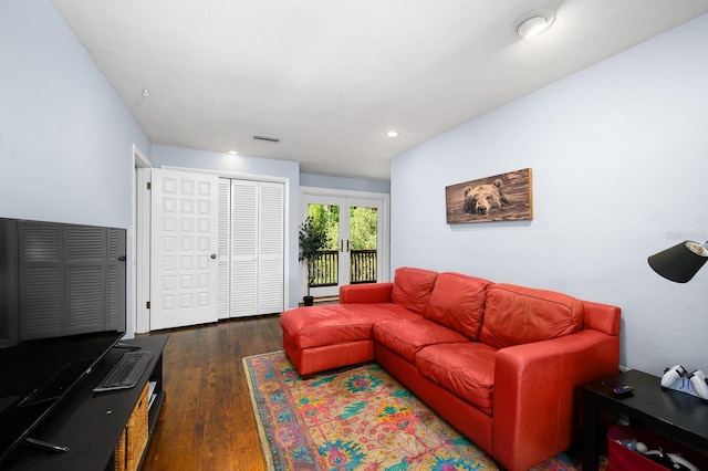 living area featuring recessed lighting, wood finished floors, and visible vents