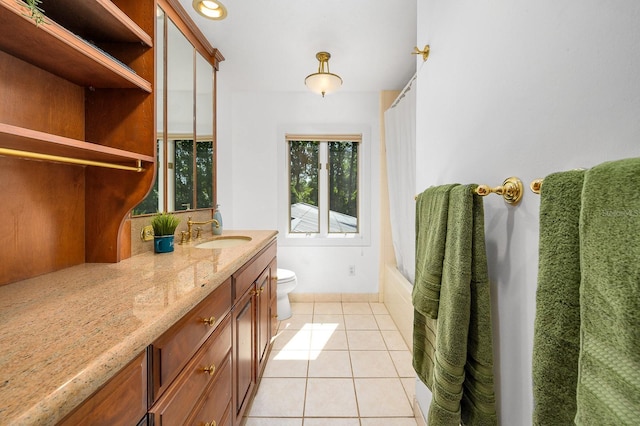 full bathroom featuring toilet, tile patterned flooring, and vanity