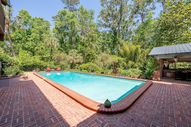 pool with a patio area