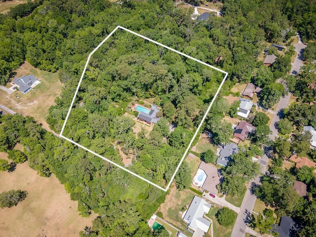 aerial view with a wooded view