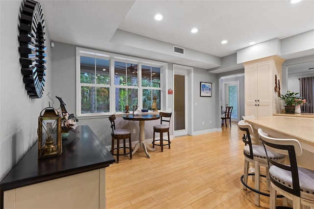 4073 SW 21st Ter, Gainesville, FL 32608 - bar featuring baseboards, recessed lighting, light wood-style flooring, and visible vents