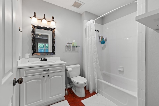 4073 SW 21st Ter, Gainesville, FL 32608 - bathroom featuring visible vents, wood finished floors, vanity, toilet, and shower / tub combo with curtain