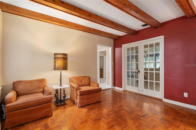 living area with baseboards, french doors, beam ceiling, and visible vents