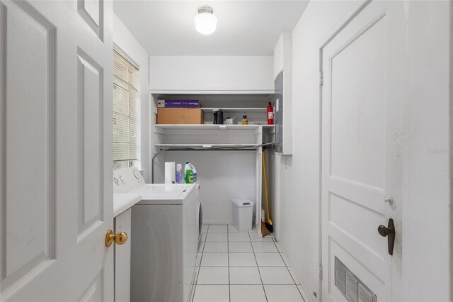 laundry room featuring laundry area, light tile patterned floors, washer and dryer, and visible vents
