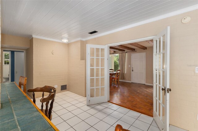dining area featuring wood ceiling, visible vents, and french doors