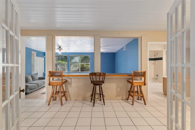 sunroom featuring french doors