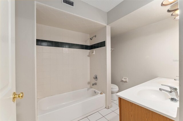 full bathroom with visible vents, tile patterned flooring, tub / shower combination, toilet, and a sink
