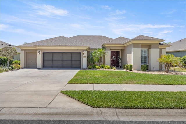 7274 SW 95th Ave, Ocala, FL 34481 - prairie-style house with a garage, stucco siding, driveway, and a front yard
