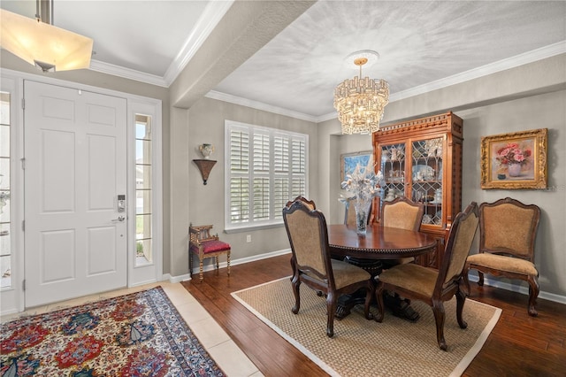 7274 SW 95th Ave, Ocala, FL 34481 - dining area featuring baseboards, ornamental molding, wood finished floors, and a chandelier