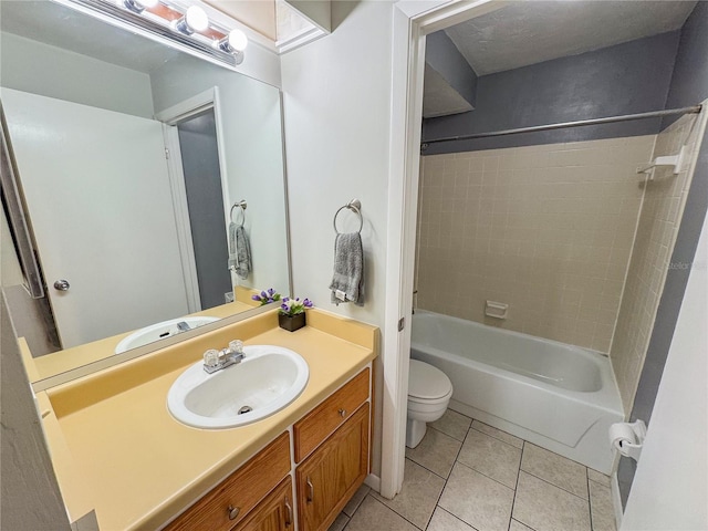 full bath with tile patterned flooring, tub / shower combination, toilet, and vanity