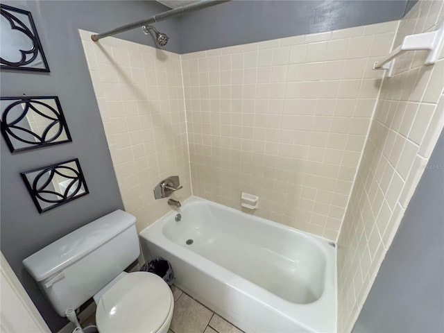 bathroom with toilet, shower / bath combination, and tile patterned floors