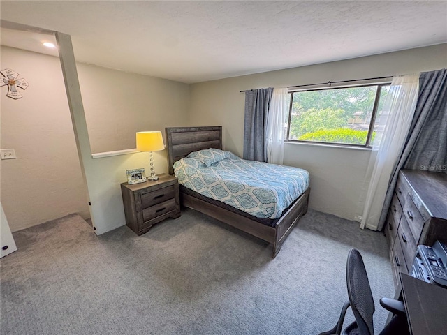 bedroom with light colored carpet
