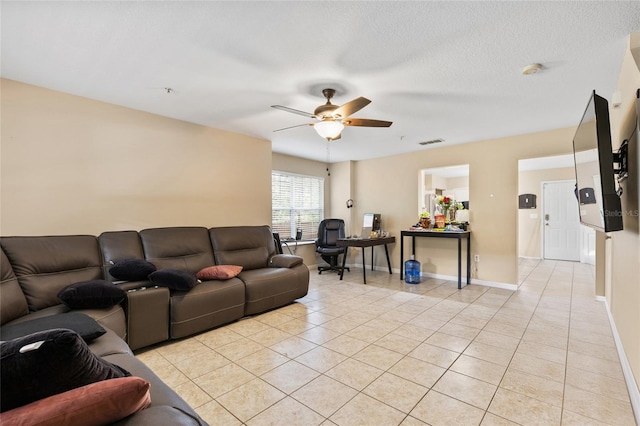 4586 SW 48th Way Unit 106, Gainesville, FL 32608 - living area featuring visible vents, baseboards, ceiling fan, and light tile patterned floors