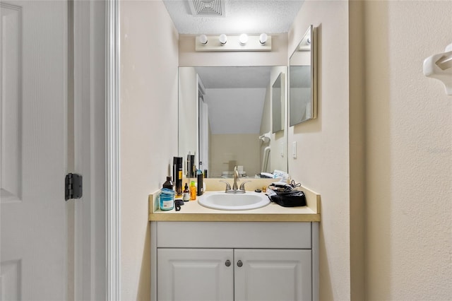 4586 SW 48th Way Unit 106, Gainesville, FL 32608 - bathroom with visible vents and vanity