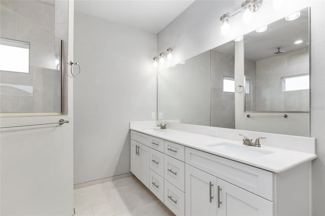 bathroom featuring a sink, plenty of natural light, and double vanity