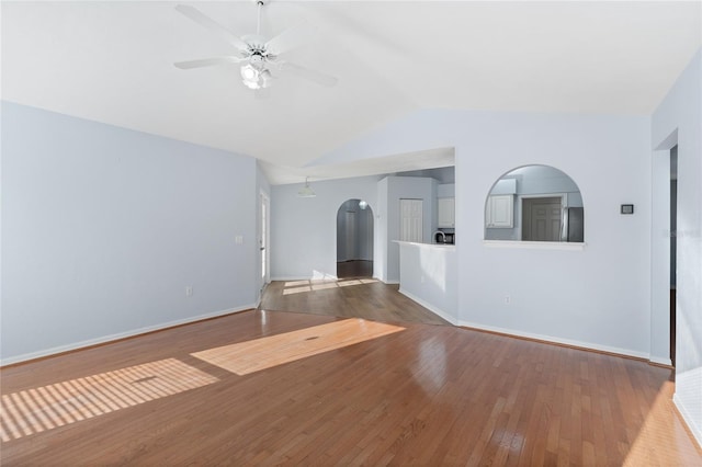 1017 NW 87th Way, Gainesville, FL 32606 - spare room featuring a ceiling fan, baseboards, lofted ceiling, and hardwood / wood-style floors