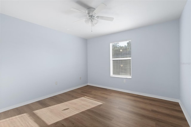 1017 NW 87th Way, Gainesville, FL 32606 - unfurnished room with baseboards, ceiling fan, and wood finished floors