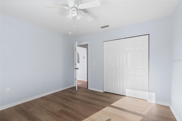 1017 NW 87th Way, Gainesville, FL 32606 - unfurnished bedroom with baseboards, visible vents, and wood finished floors