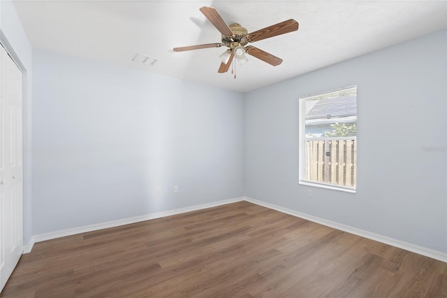 1017 NW 87th Way, Gainesville, FL 32606 - empty room featuring baseboards, ceiling fan, wood finished floors, and visible vents
