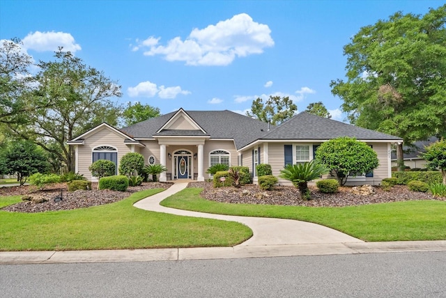 8815 SW 11th Ave, Gainesville, FL 32607 - view of front facade with roof with shingles and a front lawn
