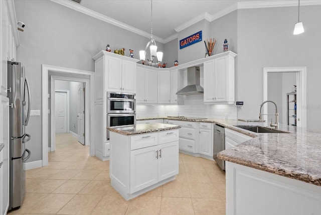 8815 SW 11th Ave, Gainesville, FL 32607 - kitchen with wall chimney range hood, white cabinets, appliances with stainless steel finishes, and a sink