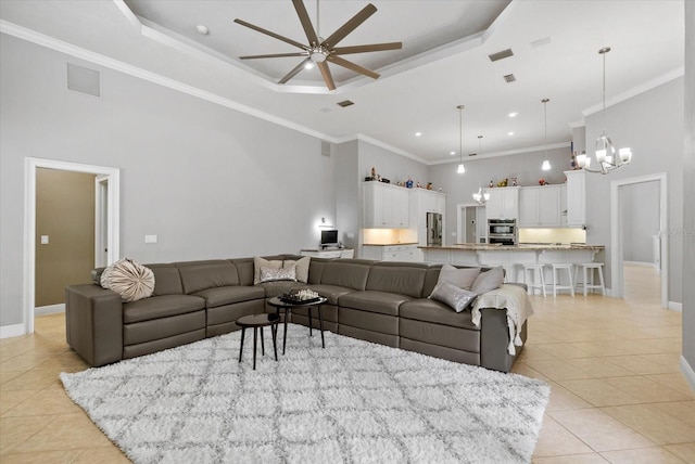 8815 SW 11th Ave, Gainesville, FL 32607 - living area featuring visible vents, light tile patterned flooring, baseboards, a high ceiling, and ceiling fan with notable chandelier