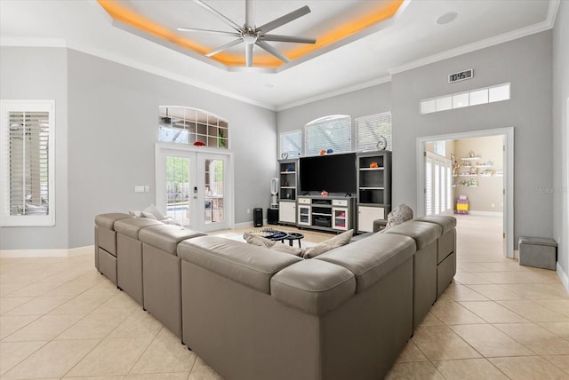8815 SW 11th Ave, Gainesville, FL 32607 - living area with light tile patterned floors, a raised ceiling, a high ceiling, and visible vents