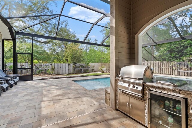 8815 SW 11th Ave, Gainesville, FL 32607 - view of patio / terrace with a grill, beverage cooler, a fenced backyard, an outdoor kitchen, and a fenced in pool