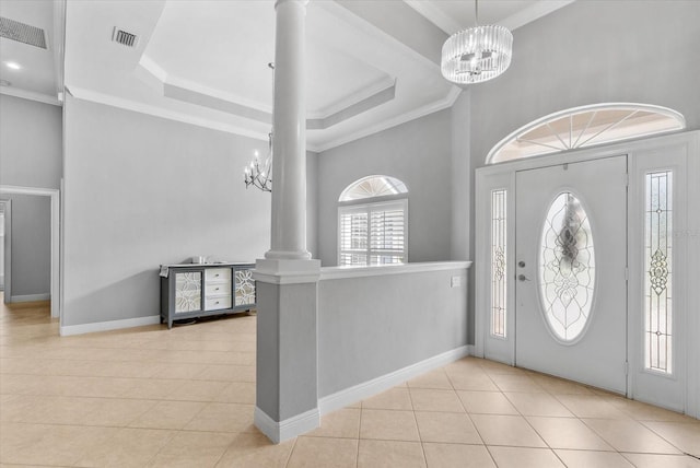8815 SW 11th Ave, Gainesville, FL 32607 - entryway featuring ornate columns, baseboards, tile patterned floors, and a chandelier
