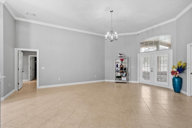 8815 SW 11th Ave, Gainesville, FL 32607 - unfurnished room featuring crown molding, baseboards, a high ceiling, a chandelier, and light tile patterned floors