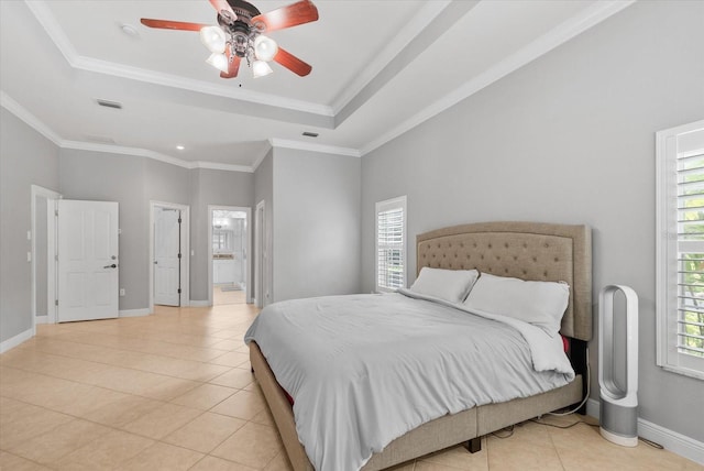 8815 SW 11th Ave, Gainesville, FL 32607 - bedroom with ensuite bath, baseboards, light tile patterned floors, a tray ceiling, and visible vents