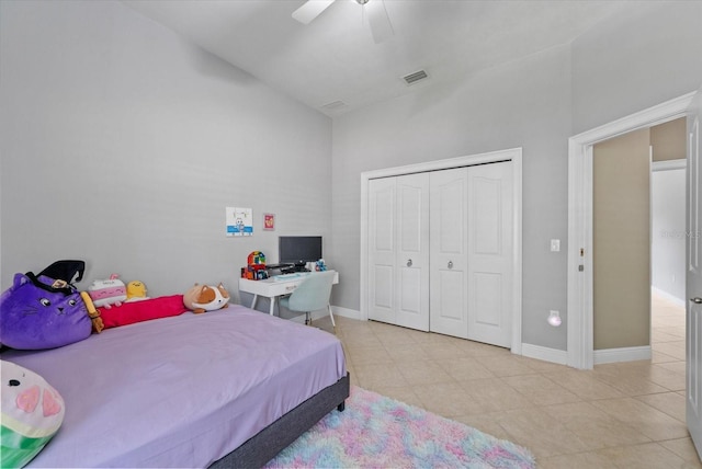 8815 SW 11th Ave, Gainesville, FL 32607 - bedroom featuring tile patterned floors, a closet, high vaulted ceiling, and visible vents