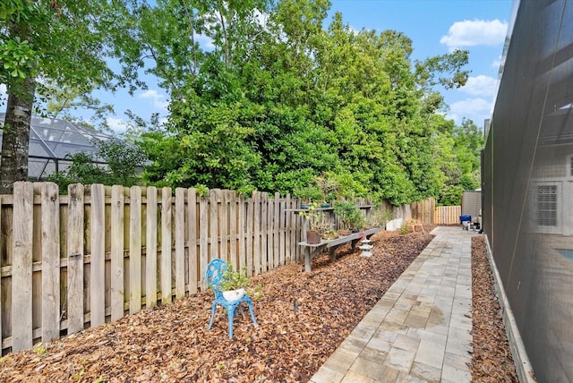 8815 SW 11th Ave, Gainesville, FL 32607 - view of yard with glass enclosure and a fenced backyard