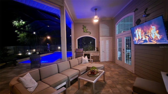 8815 SW 11th Ave, Gainesville, FL 32607 - view of patio featuring french doors, a fenced in pool, an outdoor hangout area, a fenced backyard, and an outdoor kitchen