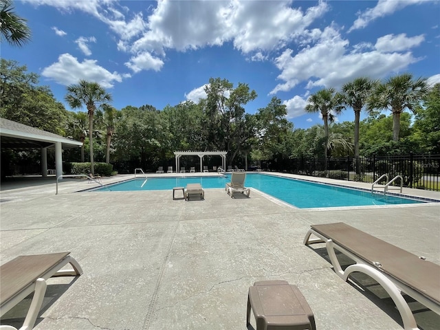 8815 SW 11th Ave, Gainesville, FL 32607 - community pool with a pergola, fence, and a patio
