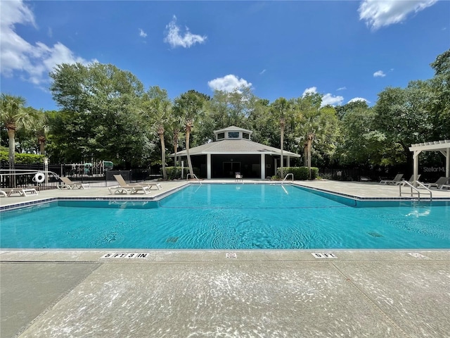 8815 SW 11th Ave, Gainesville, FL 32607 - community pool featuring a patio area, fence, and a pergola