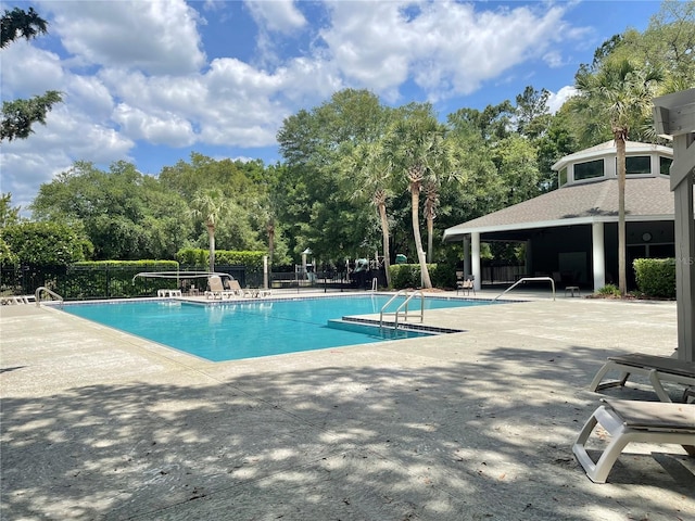 8815 SW 11th Ave, Gainesville, FL 32607 - community pool with a patio area and fence