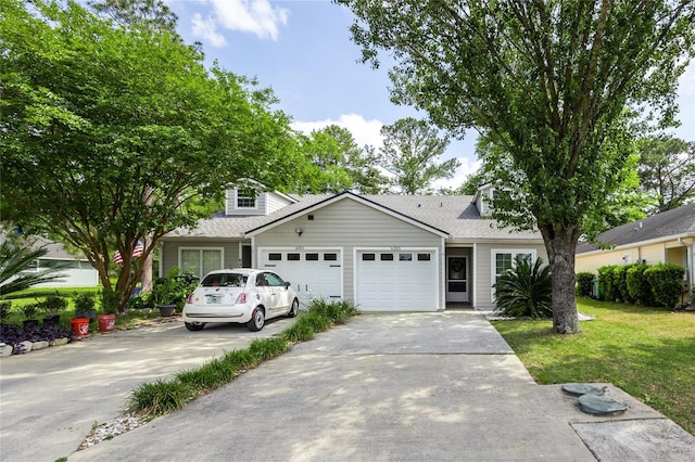 6355 NW 106th Pl, Alachua, FL 32615 - view of front of home featuring a garage, a shingled roof, concrete driveway, and a front lawn
