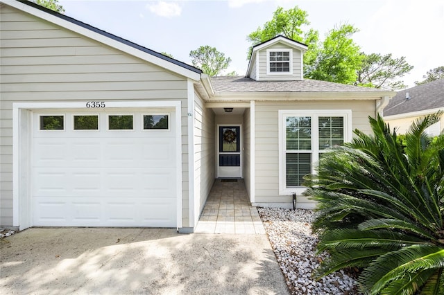 6355 NW 106th Pl, Alachua, FL 32615 - exterior space with roof with shingles, an attached garage, and concrete driveway