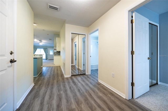 6355 NW 106th Pl, Alachua, FL 32615 - hall featuring visible vents, baseboards, and dark wood-type flooring