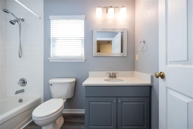 6355 NW 106th Pl, Alachua, FL 32615 - full bathroom with wood finished floors, vanity, baseboards, toilet, and bathing tub / shower combination